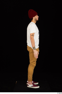 Pablo brown trousers caps  hats dressed red sneakers standing…
